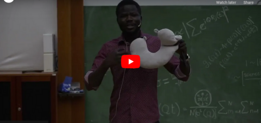 screenshot of the YouTube video preview of Ben Otange's Slam at the 1st PIER science slam showing a young man holding up a travel pillow in front of a blackboard with nonsensical formulas